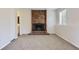 Comfortable living room features a cozy fireplace and access to bathroom at 1758 S Ensenada St, Aurora, CO 80017