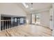 Open living space with skylight and sliding glass doors to the outside patio area at 1758 S Ensenada St, Aurora, CO 80017
