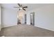 Open Primary bedroom with carpet, ceiling fan and access to bathrooms at 1758 S Ensenada St, Aurora, CO 80017