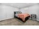 Cozy bedroom with a comfortable bed, decorative pillows, and a stylish wine rack at 2650 S Vaughn Way # D, Aurora, CO 80014