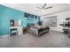 Spacious bedroom with ceiling fan, large window, and colorful decor at 2650 S Vaughn Way # D, Aurora, CO 80014