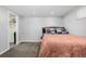 Bedroom featuring a comfortable bed, decorative pillows, and a walk-in closet at 2650 S Vaughn Way # D, Aurora, CO 80014