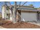Charming home with a two car garage, rock facade, mature trees, and a cozy front porch at 2650 S Vaughn Way # D, Aurora, CO 80014