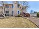 The exterior view of a charming two-story house with a well-maintained lawn on a sunny day at 2650 S Vaughn Way # D, Aurora, CO 80014
