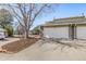 Exterior shot of two-car garages with stone accents and large driveways at 2650 S Vaughn Way # D, Aurora, CO 80014