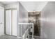 Hallway featuring carpeted stairs and chandelier at 2650 S Vaughn Way # D, Aurora, CO 80014