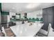 Kitchen with stainless steel appliances, white cabinets, contrasting countertops, and large center island at 2650 S Vaughn Way # D, Aurora, CO 80014