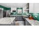 Well-equipped kitchen boasting stainless steel appliances, granite countertops, and ample cabinet space at 2650 S Vaughn Way # D, Aurora, CO 80014