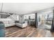 Spacious living room with open floor plan and sliding glass doors to the outdoor deck at 2650 S Vaughn Way # D, Aurora, CO 80014
