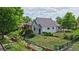 Charming home exterior surrounded by lush greenery and a well-maintained lawn at 2809 Yates St, Denver, CO 80212
