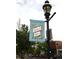 Highlands Square banner on a light pole with a historic urban charm amidst trees and buildings at 2809 Yates St, Denver, CO 80212