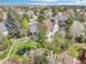 This aerial shows an expansive yard, complemented by a white fence and mature landscaping at 742 Norwich Ct, Castle Pines, CO 80108
