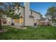 Exterior of the home featuring well-maintained landscaping and a cozy backyard at 742 Norwich Ct, Castle Pines, CO 80108