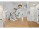 Bright foyer featuring a curved staircase and chandelier at 742 Norwich Ct, Castle Pines, CO 80108
