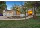Charming home boasting beautiful landscaping, inviting walkway, and a three-car garage at 742 Norwich Ct, Castle Pines, CO 80108