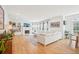 Bright and airy living room with a fireplace, shelving, and a large sectional sofa at 742 Norwich Ct, Castle Pines, CO 80108