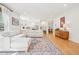 Open-concept living space with hardwood floors and natural light at 742 Norwich Ct, Castle Pines, CO 80108