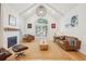 A sun-filled living room offers high ceilings, a fireplace, and modern decor at 742 Norwich Ct, Castle Pines, CO 80108