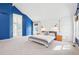 Spacious main bedroom with white walls, a blue accent wall, and carpeted flooring at 742 Norwich Ct, Castle Pines, CO 80108