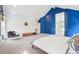 Spacious carpeted main bedroom with blue accent walls and plenty of natural light at 742 Norwich Ct, Castle Pines, CO 80108