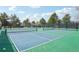A well maintained tennis court in an outdoor setting on a sunny day at 742 Norwich Ct, Castle Pines, CO 80108