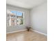 Spacious room featuring a large window with a view of the surrounding buildings at 12348 W Dorado Pl # 204, Littleton, CO 80127