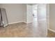 Bedroom showcasing tile flooring, a standing mirror, and doorway to another room at 12348 W Dorado Pl # 204, Littleton, CO 80127