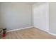 Bedroom showcasing the light wood flooring and a closet with sliding paneled doors at 12348 W Dorado Pl # 204, Littleton, CO 80127