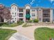 Inviting condominium complex featuring well-manicured lawns and attractive architectural details at 12348 W Dorado Pl # 204, Littleton, CO 80127