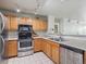 Bright kitchen with modern stainless steel appliances, stylish lighting and a functional layout at 12348 W Dorado Pl # 204, Littleton, CO 80127