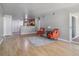 Spacious living room with open flow to kitchen and sliding door access to a balcony at 12348 W Dorado Pl # 204, Littleton, CO 80127