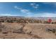 An aerial view showcasing a community with mountain views at 452 Deframe Ct, Golden, CO 80401