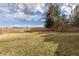 Expansive backyard features a fenced perimeter, a basketball hoop, and a large grassy area, perfect for recreation and play at 452 Deframe Ct, Golden, CO 80401
