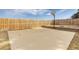 Outdoor basketball court features a hoop, backboard, and fenced perimeter, for recreational sports at home at 452 Deframe Ct, Golden, CO 80401