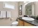 Bathroom featuring granite countertop, neutral paint, and a shower and tub combo at 452 Deframe Ct, Golden, CO 80401