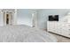 Spacious bedroom with light walls, carpet floors, and a white dresser at 452 Deframe Ct, Golden, CO 80401