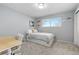 Bedroom with grey walls, grey carpet, built-ins, and lots of natural light at 452 Deframe Ct, Golden, CO 80401