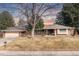 Charming single-story brick home featuring an attached garage and a well-maintained front yard at 452 Deframe Ct, Golden, CO 80401