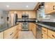 Kitchen featuring stainless steel appliances, granite countertops, and plenty of cabinet space at 452 Deframe Ct, Golden, CO 80401