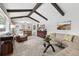Spacious living room with modern furnishings, stylish decor, and an open view to the dining area at 452 Deframe Ct, Golden, CO 80401