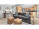 Inviting living room featuring a comfortable couch that flows into the kitchen area at 452 Deframe Ct, Golden, CO 80401