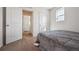 Neutral bedroom features carpeted floors, and a bright window at 608 N Bersshine Ct, Watkins, CO 80137