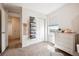 Bright bedroom with a closet, window, plush carpet and a view into the hallway at 608 N Bersshine Ct, Watkins, CO 80137