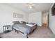 Bedroom featuring a ceiling fan, botanical art, and neutral colors at 608 N Bersshine Ct, Watkins, CO 80137