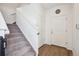 Light and bright entryway featuring a coat closet and stairs leading to the upper level at 608 N Bersshine Ct, Watkins, CO 80137