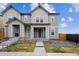 Charming two-story home featuring a welcoming front porch and a well-maintained lawn in a suburban neighborhood at 608 N Bersshine Ct, Watkins, CO 80137