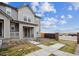 Charming two-story home with a landscaped front yard, concrete walkway, and inviting entrance at 608 N Bersshine Ct, Watkins, CO 80137