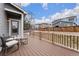 Spacious deck with seating area, overlooking a fenced backyard at 12243 Joplin St, Commerce City, CO 80603