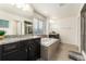 Elegant bathroom with double vanity, soaking tub, and walk-in shower at 12243 Joplin St, Commerce City, CO 80603