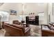 Living room with high ceilings, hardwood floors, and a media center at 12243 Joplin St, Commerce City, CO 80603